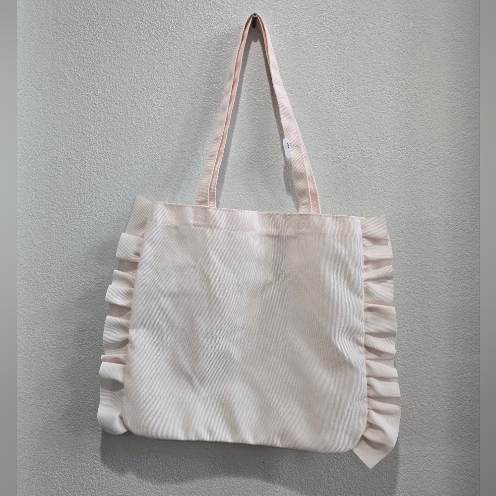 Bath and Body Works pink ruffled tote.